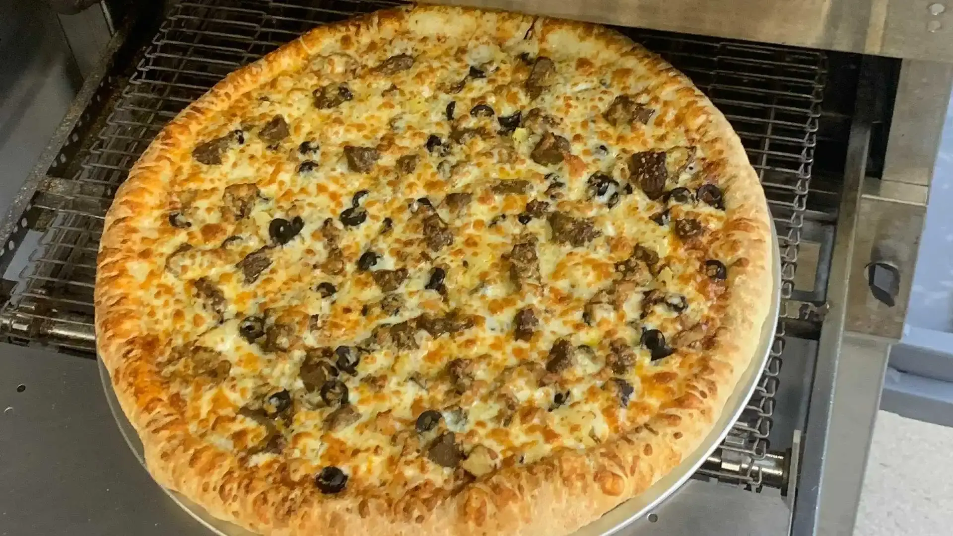 Delicious Three Toppings Pizza at Savvy Pizza & Donair in Calgary, AB